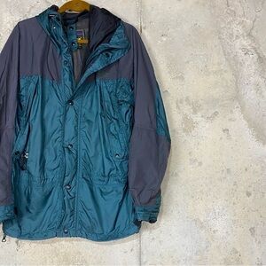 Solstice black emerald green two toned rise resistant wind breaker hooded jacket